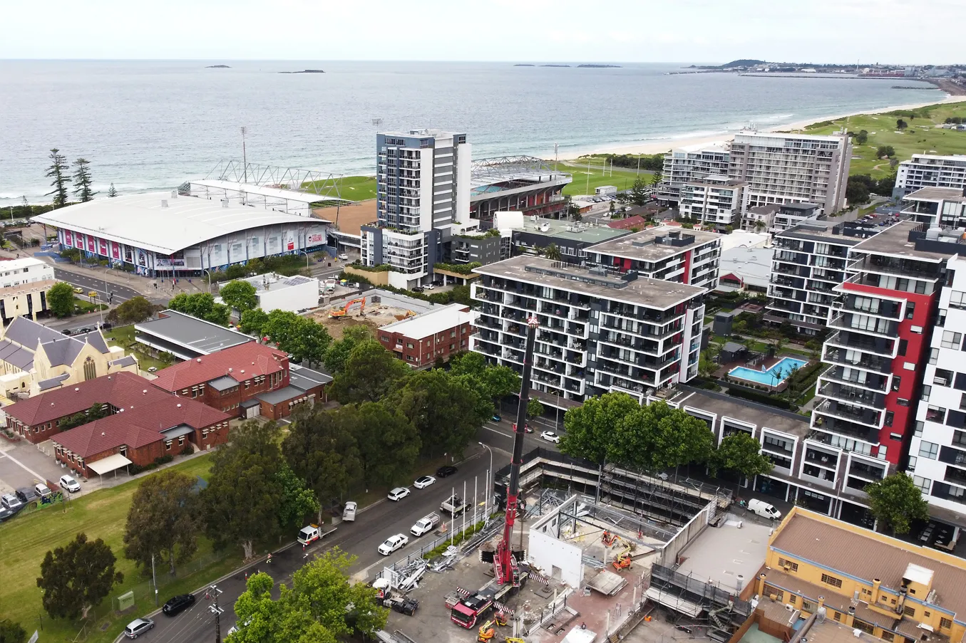 WCED excavator demolishing a multi-storey commercial building in Wollongong